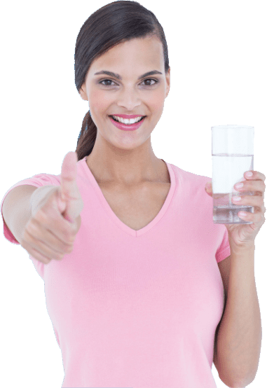A woman holding up her thumb and a glass of milk.